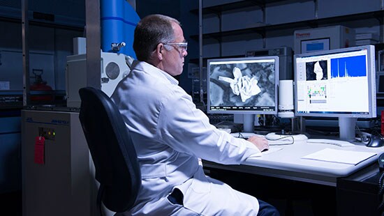 Scientist at computer monitors