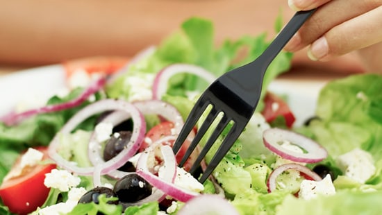 FoodSafety,green salad with a fork.