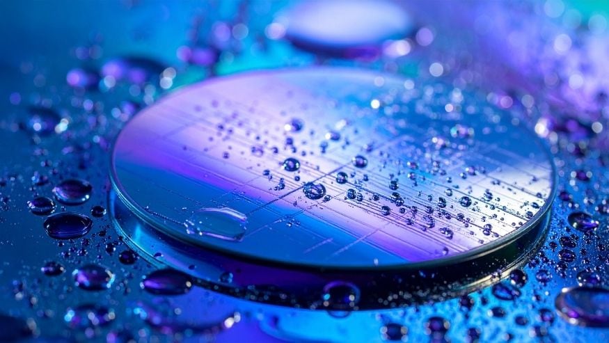 Firefly_blue and purple silicon wafer with water droplets refracting light over its surface