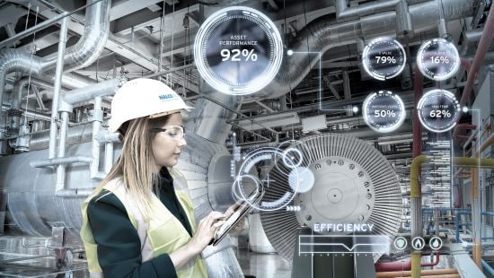 engineer viewing a tablet in boiler room, various bubbles show data and information from the tablet